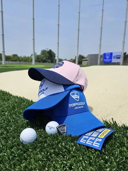 Various Topgolf branded merchandise items on display