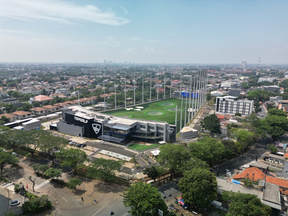 Bird’s-eye view of Topgolf highlighting the driving range and entertainment area